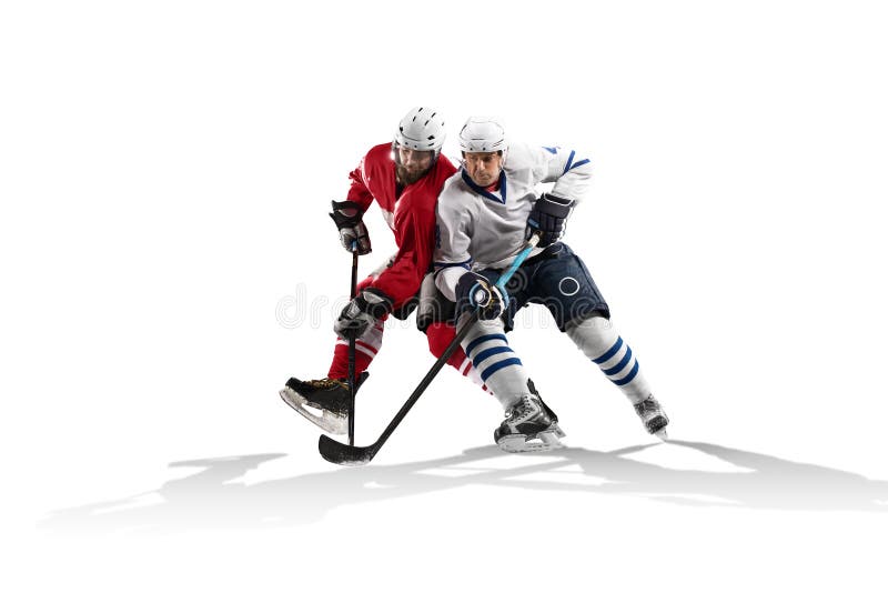 Professional hockey player skating on ice. Isolated in white stock photography