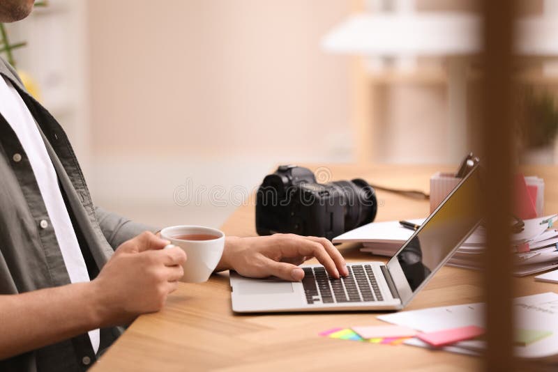 Professional journalist working with laptop in office royalty free stock photography