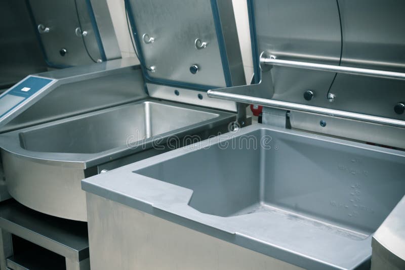 Professional kitchen steel equipment for food preparing. Toned stock image