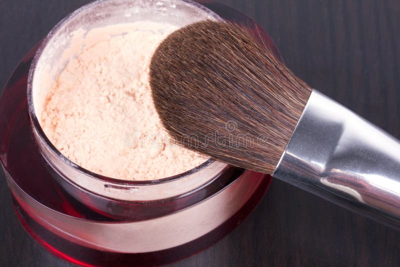 Professional make-up brush on box with powder