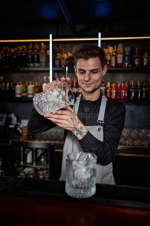 Professional Male Bartender Makes an Alcoholic Cocktail Stock Image