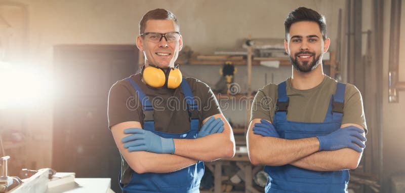 Professional male carpenters in workshop. Banner design royalty free stock photography