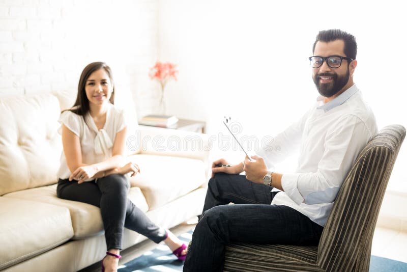 Professional male psychologist with female client royalty free stock image Professional male psychologist with female client royalty free stock image
