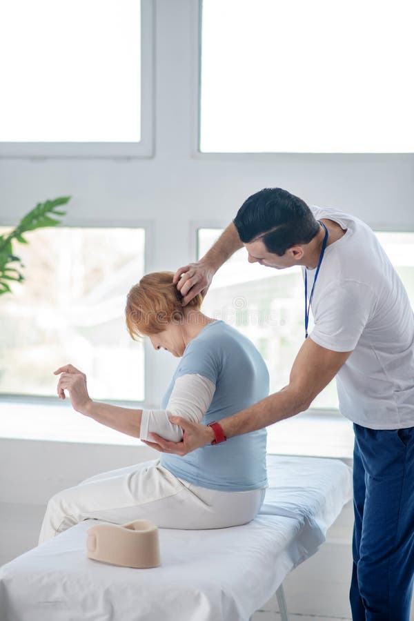 Professional Male Therapist Doing Massage For His Patient Stock Image Image Of Medicine Neck