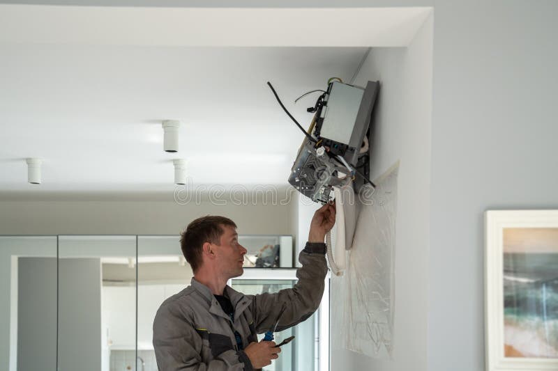 Professional Man Worker of Climate Control Service in Carries Out