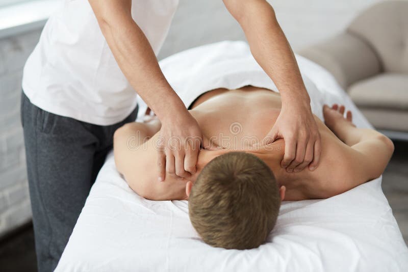 A Man Having a Back Massage · Free Stock Photo