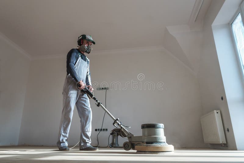 The professional master polishes the parquet royalty free stock photos The professional master polishes the parquet royalty free stock photos