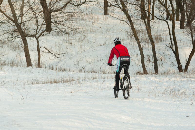 Professional mountain cyclist in winter training on the local hills stock images Professional mountain cyclist in winter training on the local hills stock images