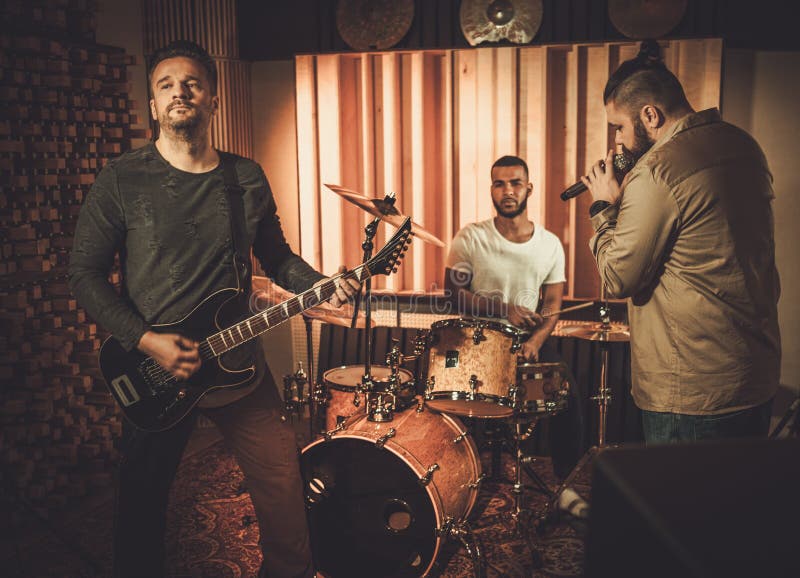 Professional Music Band Performing in Boutique Recording Studio Stock Image Image of guitar