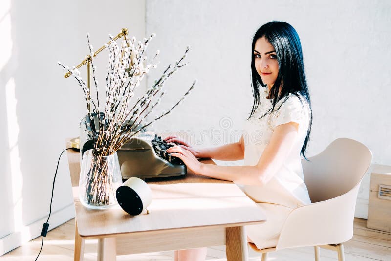 Professional occupation. Secretary in white dress typing documents royalty free stock photo Professional occupation. Secretary in white dress typing documents royalty free stock photo