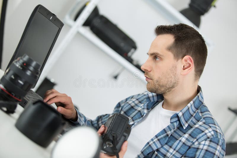 Professional Photographer Checking Laptop Stock Photo Image of still