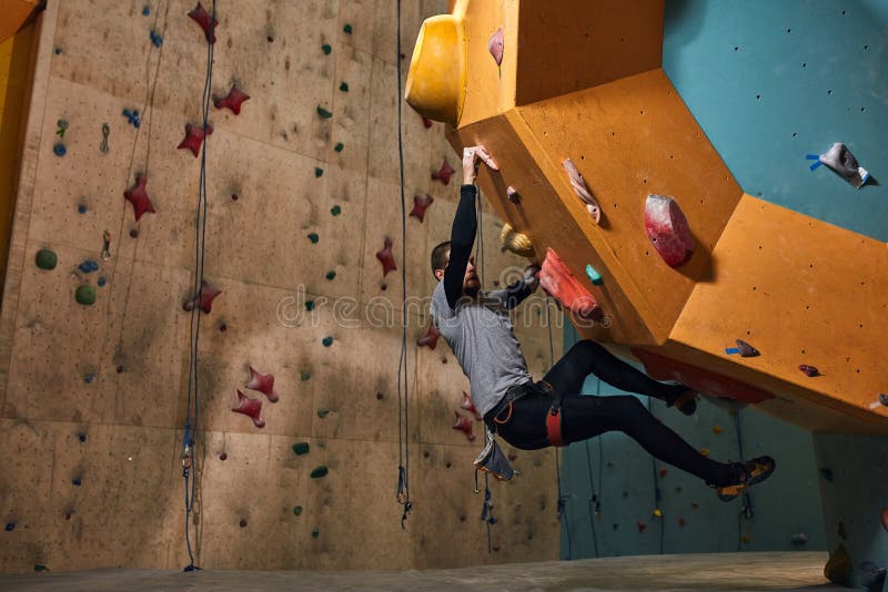 Professional physically challenged boulderer training hard after warming up royalty free stock photo