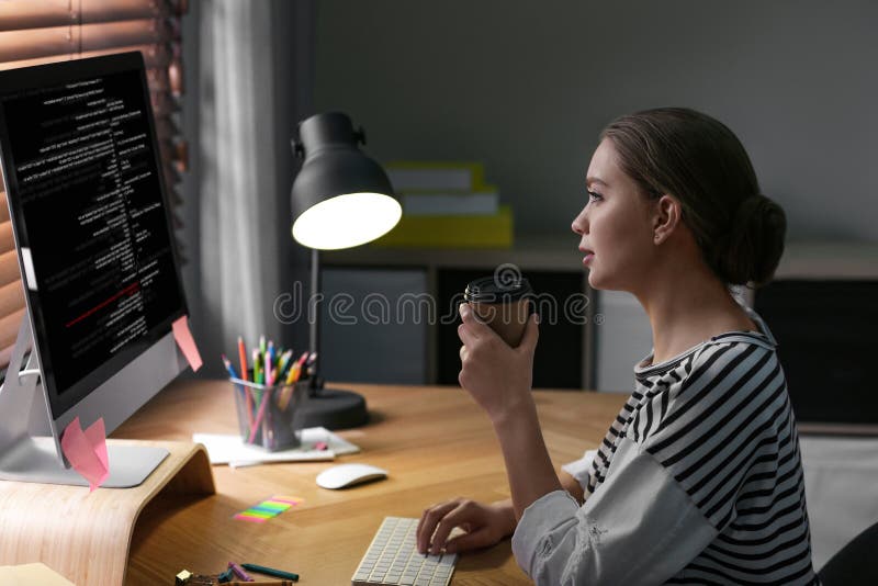 Professional programmer working with computer stock photography