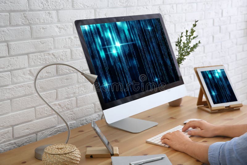 Programmer working with computer in office, closeup stock photography