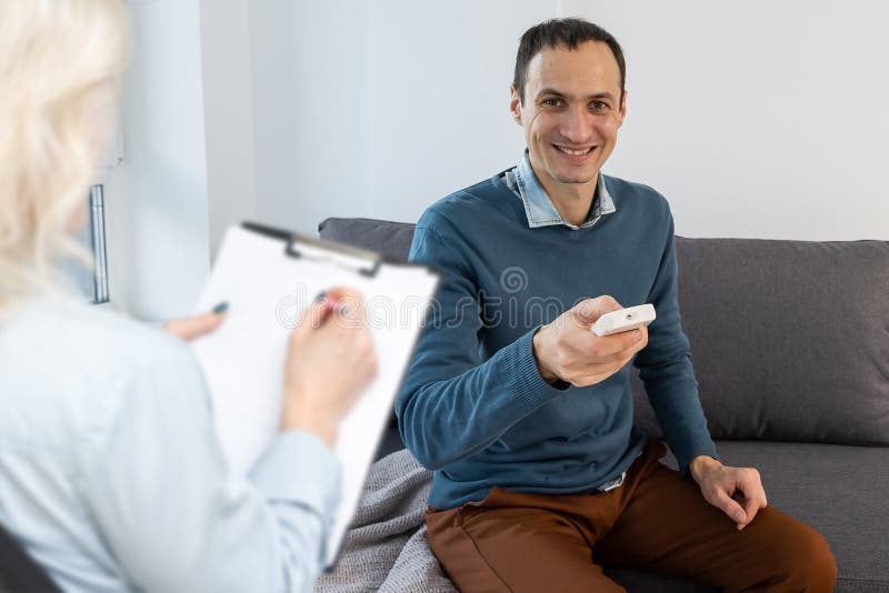 Professional Psychologist Conducting a Consultation. Stock Photo