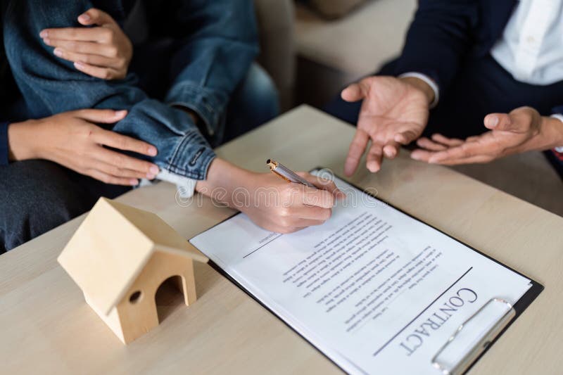 Professional Real Estate Agent Guiding and Explaining the Document