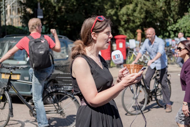 Professional reporter and news reader using a radio station microphone. stock photos