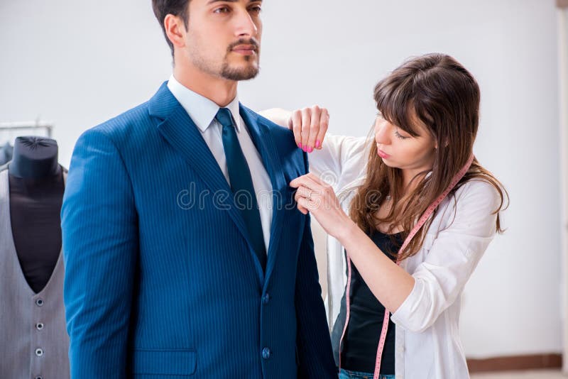 The Professional Tailor Taking Measurements for Formal Suit Stock Image ...