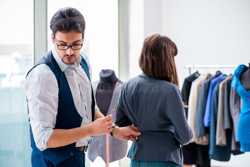 The Professional Tailor Taking Measurements for Formal Suit Stock Image ...