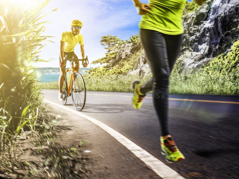 Professional triathlon man and woman running and ciclyng stock photos Professional triathlon man and woman running and ciclyng stock photos