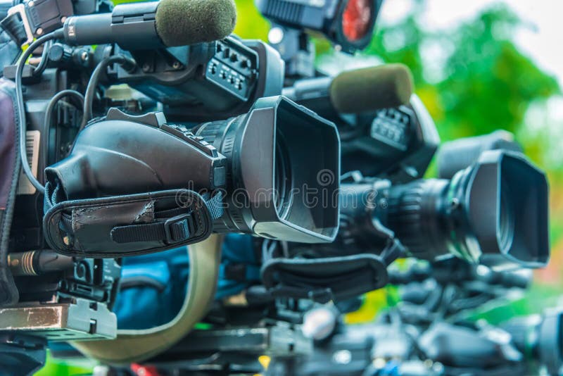 Professional tv cameras on tripods recording social event royalty free stock photography Professional tv cameras on tripods recording social event royalty free stock photography