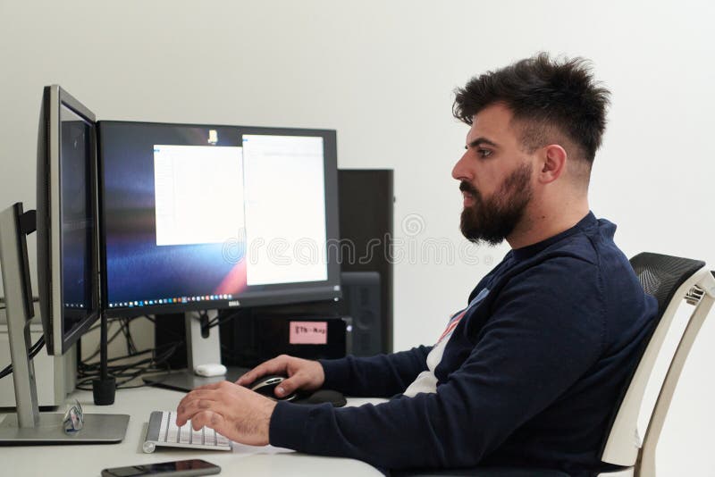 Professional video editor enhancing digital footage using specialized software royalty free stock photo