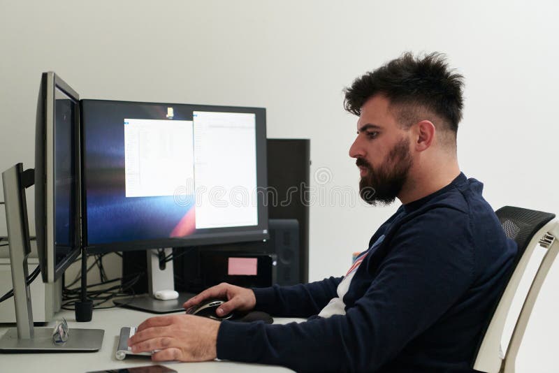 Professional video editor enhancing digital footage using specialized software royalty free stock photography