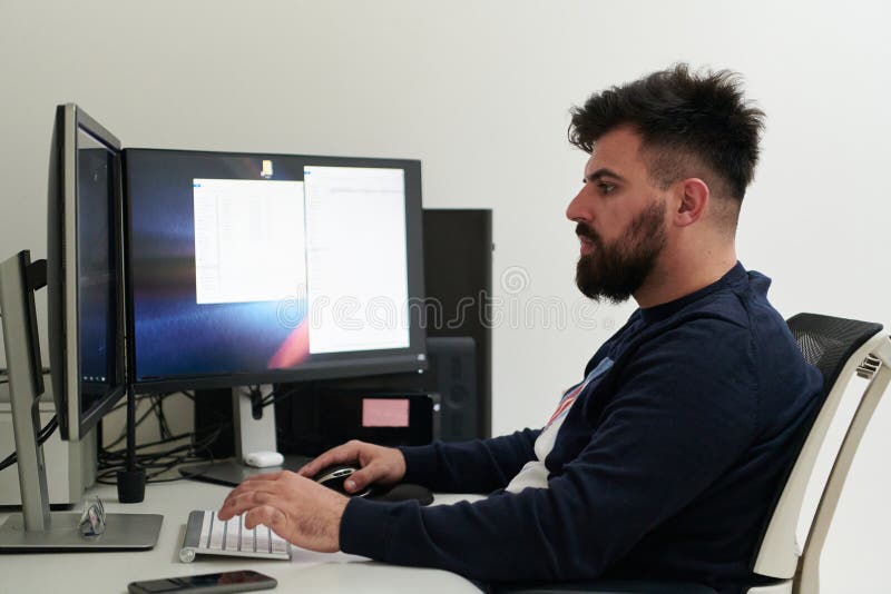 Professional video editor enhancing digital footage using specialized software royalty free stock photography