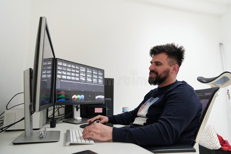 Professional video editor enhancing digital footage using specialized software royalty free stock photos