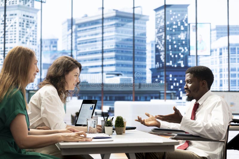Professional in wheelchair in office highlighting corporate inclusivity royalty free stock images