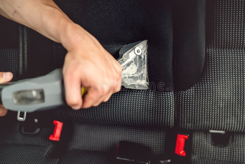 Detailing and Car Care Concept Professional Using Steam Vacuum for