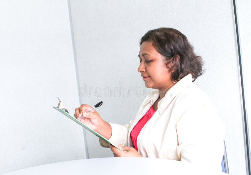 Professional working woman with jacket royalty free stock photo