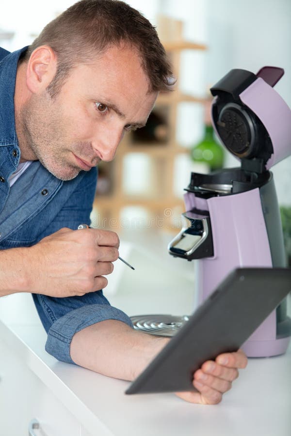 Professional Young Repairman Fixing Coffee Machine Stock Photo Image