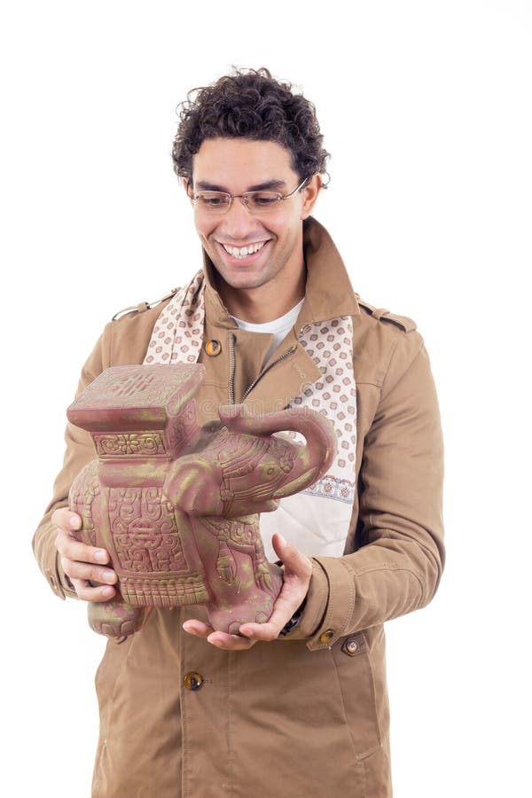 Professor die in laag met glazen oud artefact kijken royalty-vrije stock fotografie Professor die in laag met glazen oud artefact kijken royalty-vrije stock fotografie