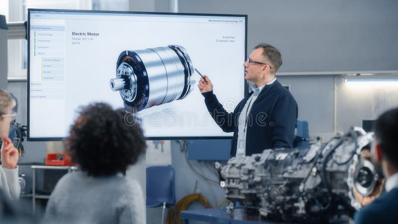 Professor Lectures Diverse Group of Multi Ethnic Students and Pointing at 3D Model of Turbine Engine stock photography