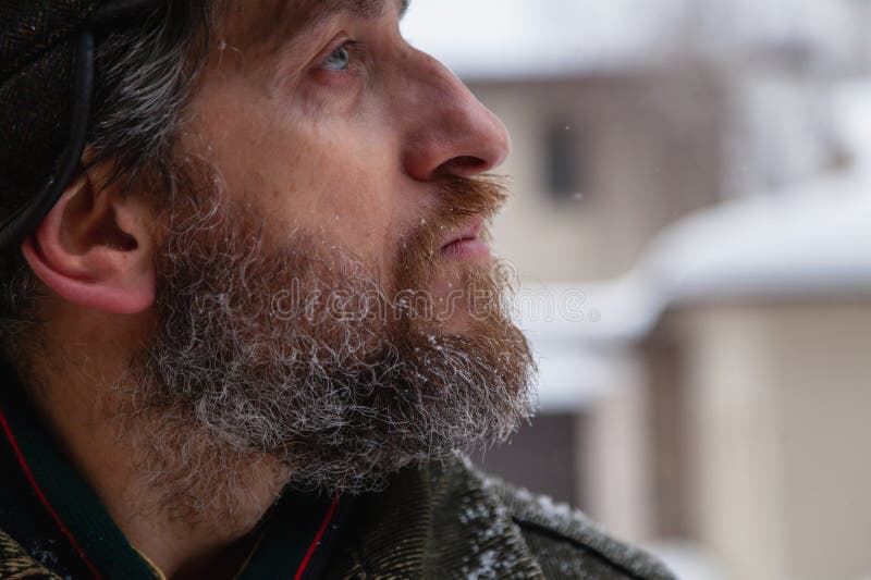 Profile of man on winter day stock image
