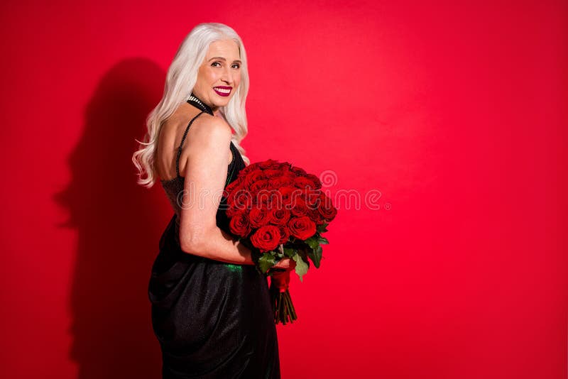 Profile photo of attractive aged grey haired lady luxury look evening makeup hold big bunch roses valentine day present royalty free stock photos Profile photo of attractive aged grey haired lady luxury look evening makeup hold big bunch roses valentine day present royalty free stock photos