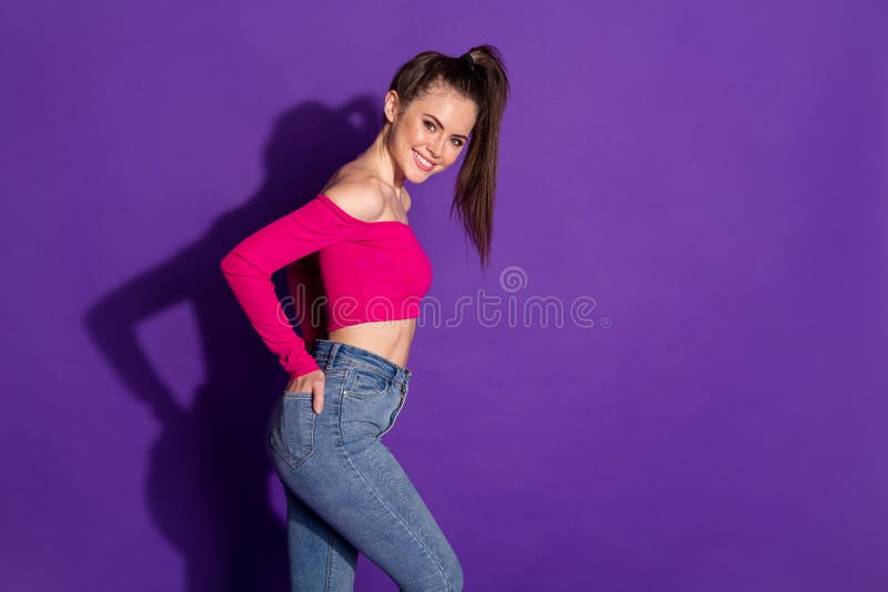 Profile side view portrait of attractive cheerful slender girl posing isolated over bright violet color background