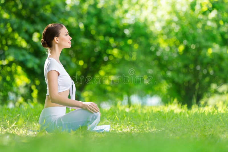 Profile of woman in asana position