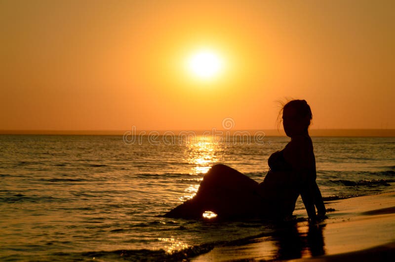 Profile of a Sad Young Woman Silhouette in Swimsuit Stock Image