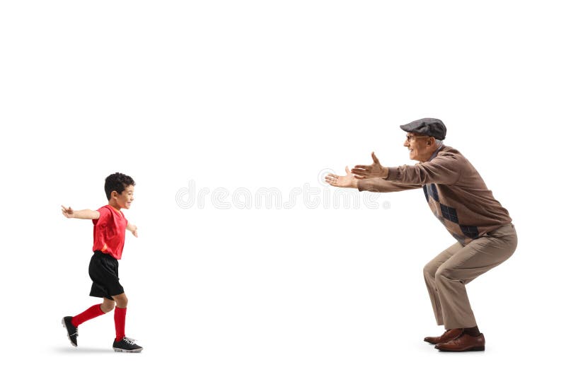 Profilul de lungime completă împușcat de un băiat care rulează spre bunicul stock images