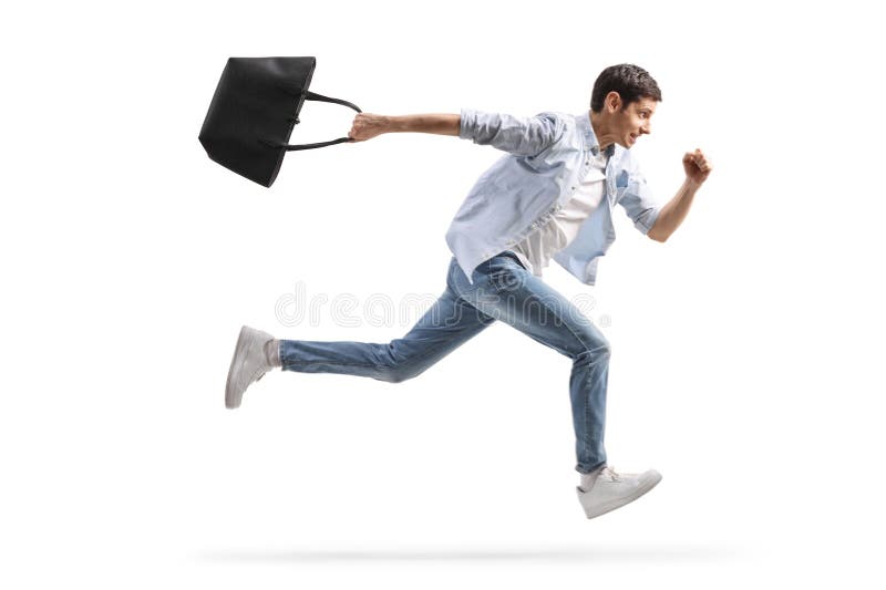 Profilul de lungime completă împușcat de un om care rulează cu o geantă de mână femeie stock photos