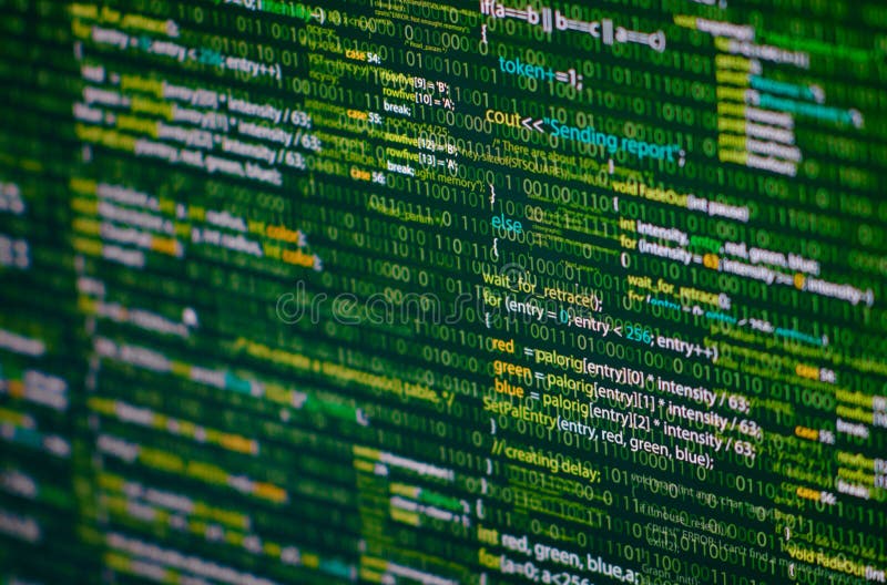 Programming abstract - source code and binary code on display of software developer. Green theme.
