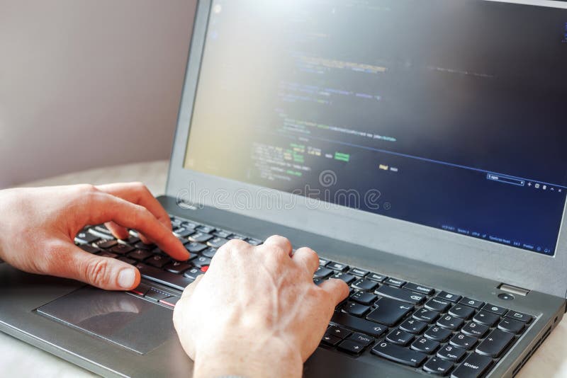 Programmer coding on laptop computer. Coder hand closeup writing program code royalty free stock photography Programmer coding on laptop computer. Coder hand closeup writing program code royalty free stock photography