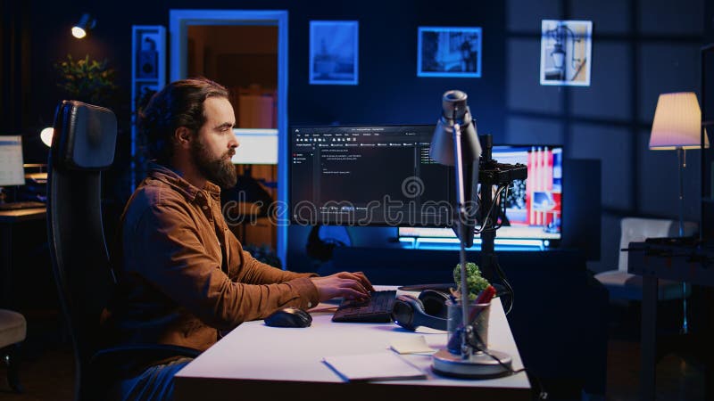 Programmer developing code on computer screen while in personal office using java programming languages. IT admin working with software tool, fixing database errors while working from home, camera B. Developing programmer stock images, royalty-free photos and pictures