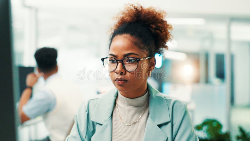 Programmer, research or woman with glasses in office for writing code, app development and debugging. Computer stock image