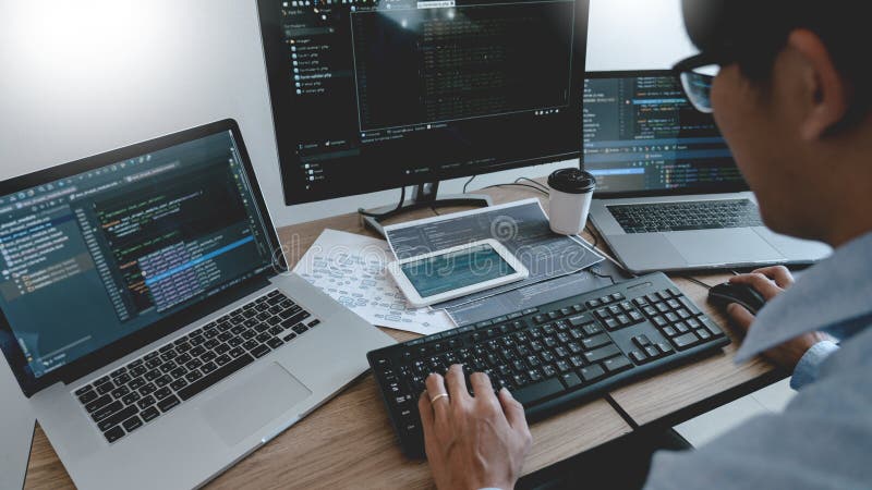 Programmer Typing Code on desktop computer, Developing programming and coding technologies concept. Developing programmer stock images, royalty-free photos and pictures
