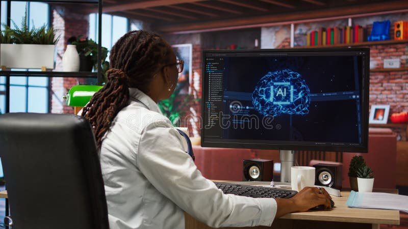 Programmer using computer at home for artificial intelligence computing stock image