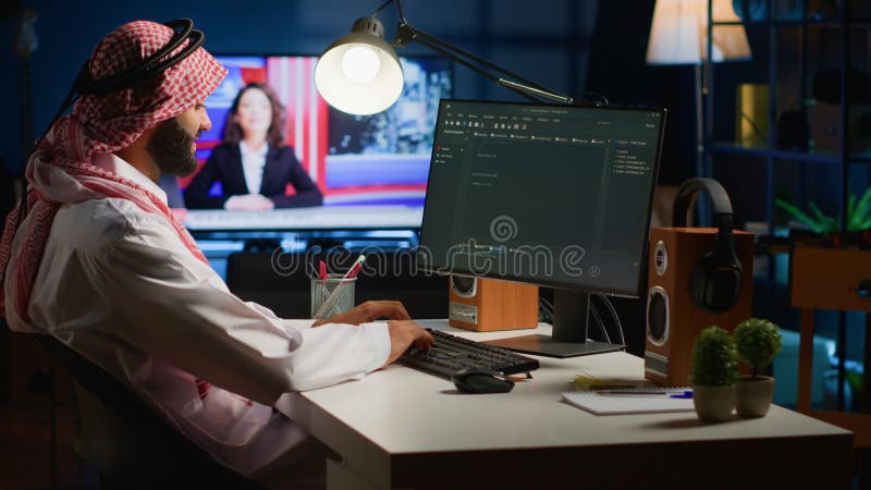 Qualified arab programmer writing code on computer screen while in office using Java programming languages. Middle Eastern Developer working on fixing database errors while working from home. Programming coding script java stock images, royalty-free photos and pictures