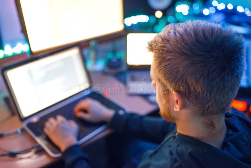 Programmer using laptop and PC, information coding stock images Programmer using laptop and PC, information coding stock images